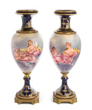 A Pair of 24” 19th/20th-Century Gilt Bronze Mounted Sevres Style Porcelain Urns